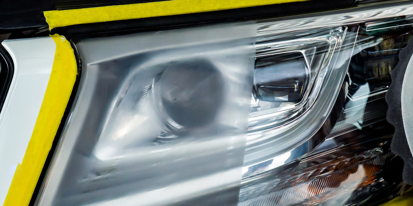 Before and after headlight restoration showing clear and bright lens in Montreal.