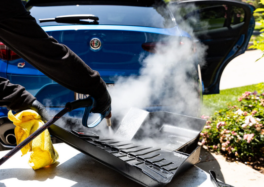 Professional steam cleaning of car dashboard and vents during interior deep clean service in Montreal