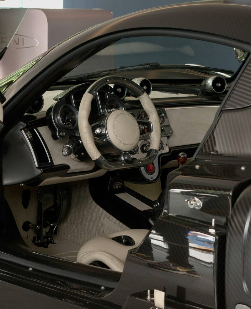 Pagani luxury car interior with carbon fiber details, premium leather steering wheel, and custom dashboard – highlighted by A&A Car Detailing in Montréal & Laval.